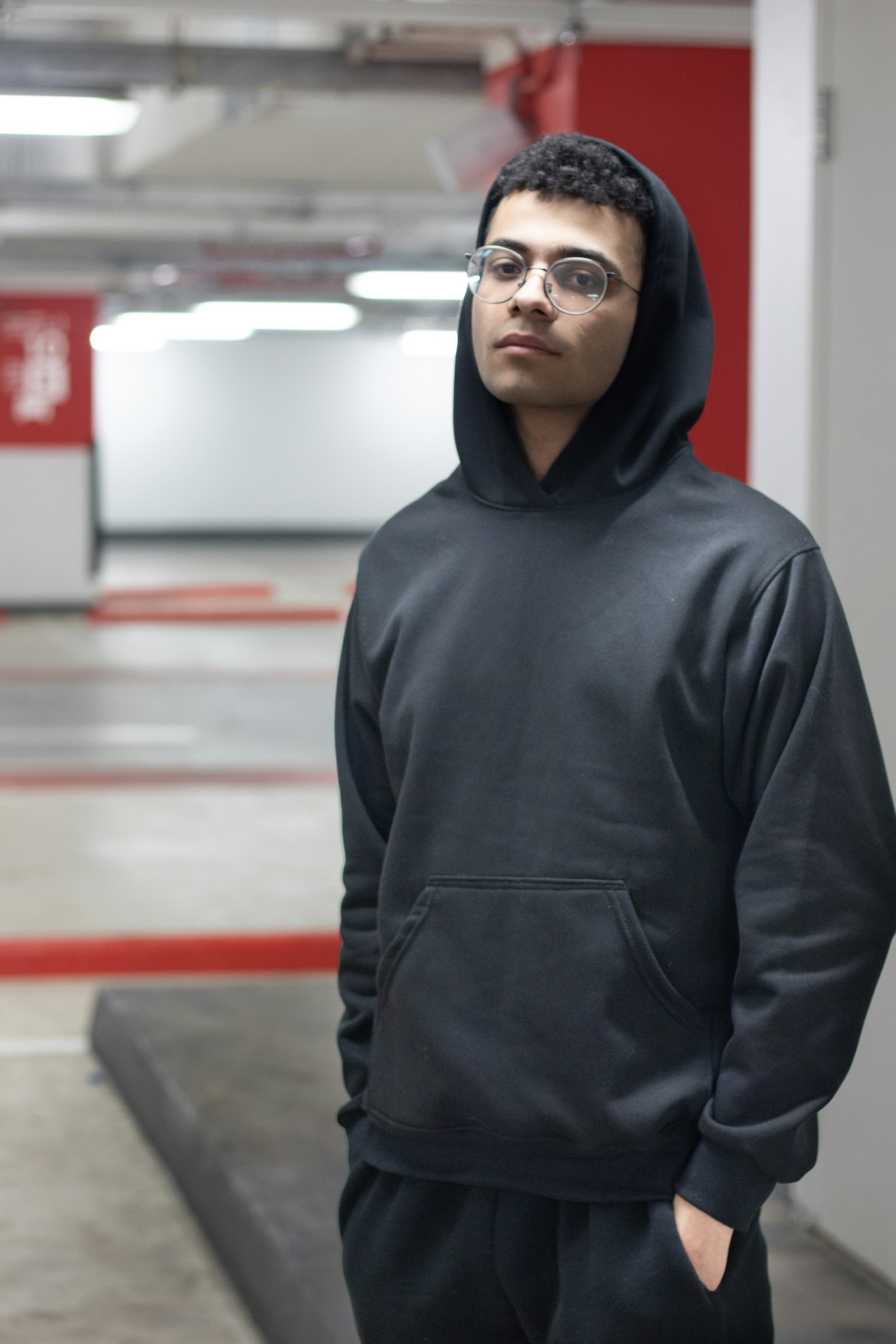 Black heavyweight lift hoodie worn with the hood up