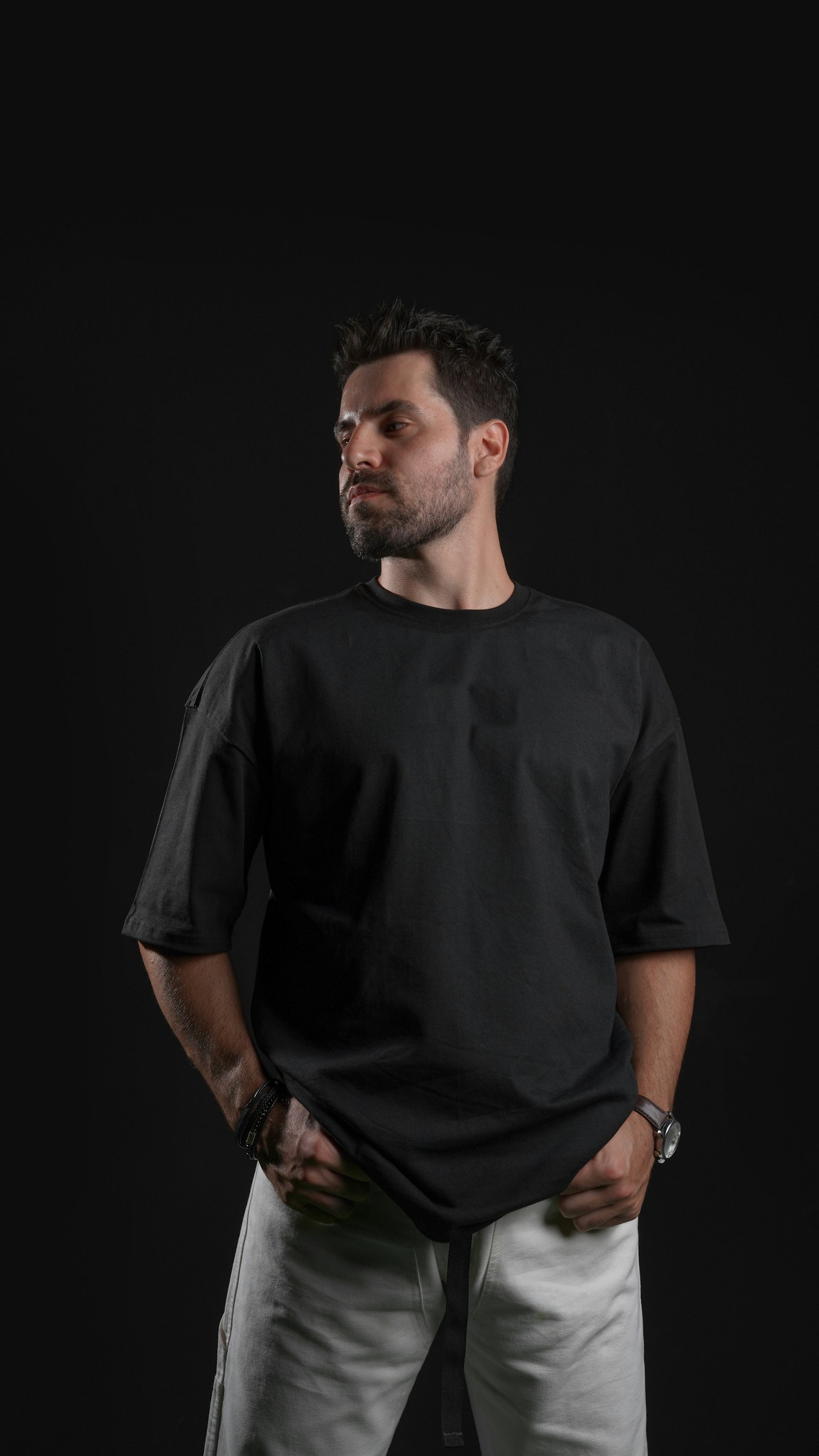 Black oversized pump cover with dropped shoulders on an athlete